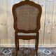 Suite de 10 chaises de style Louis XV en noyer et cannage