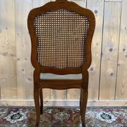 Set of 10 Louis XV style chairs in walnut and cane.