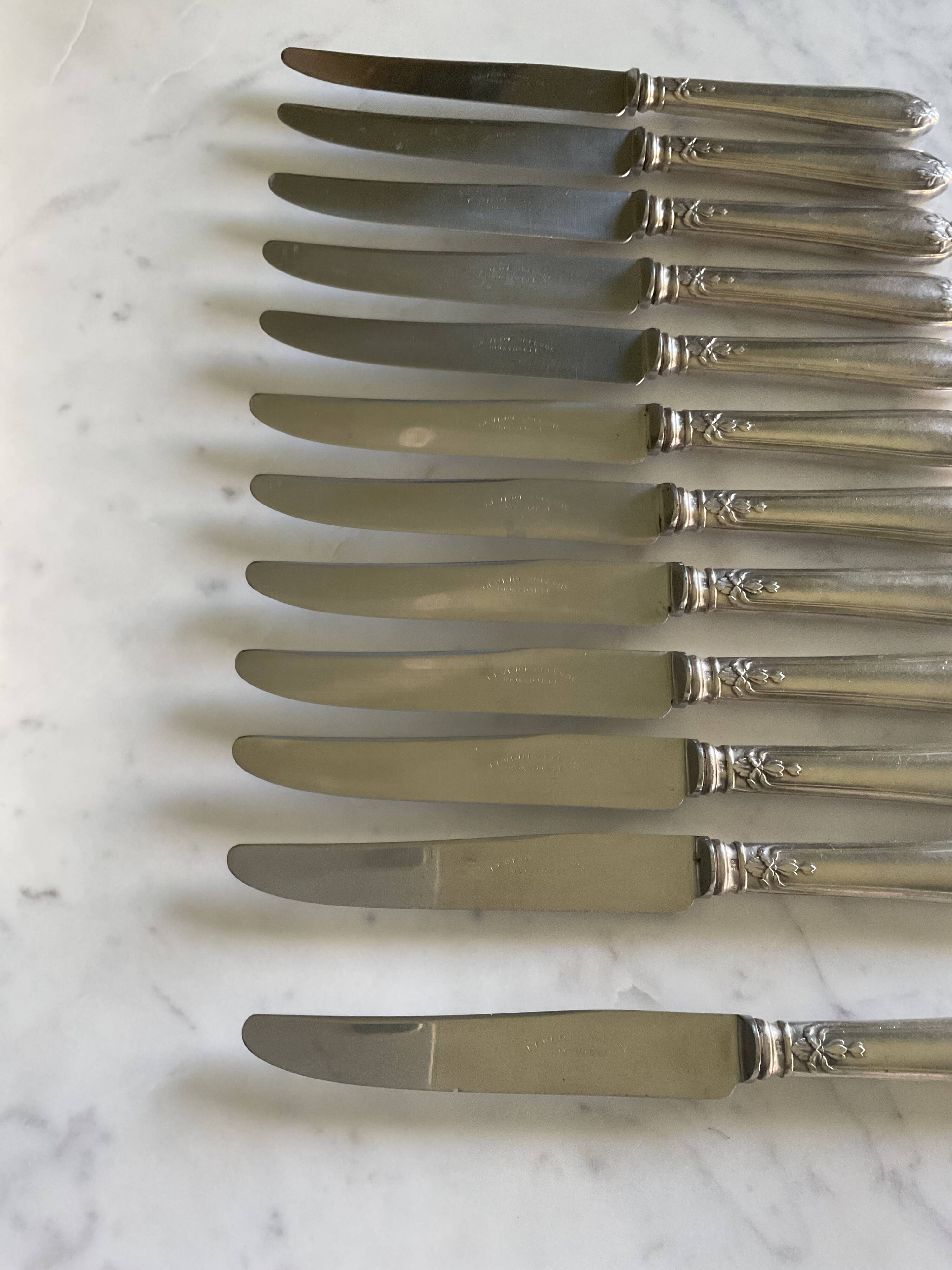 12 silver-plated metal knives. levert silversmith
