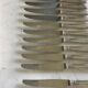 12 silver-plated metal knives. levert silversmith