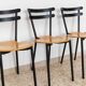 Set of 3 Italian mid-century chairs in black steel frame and natural wood seats - stackable, 1970s