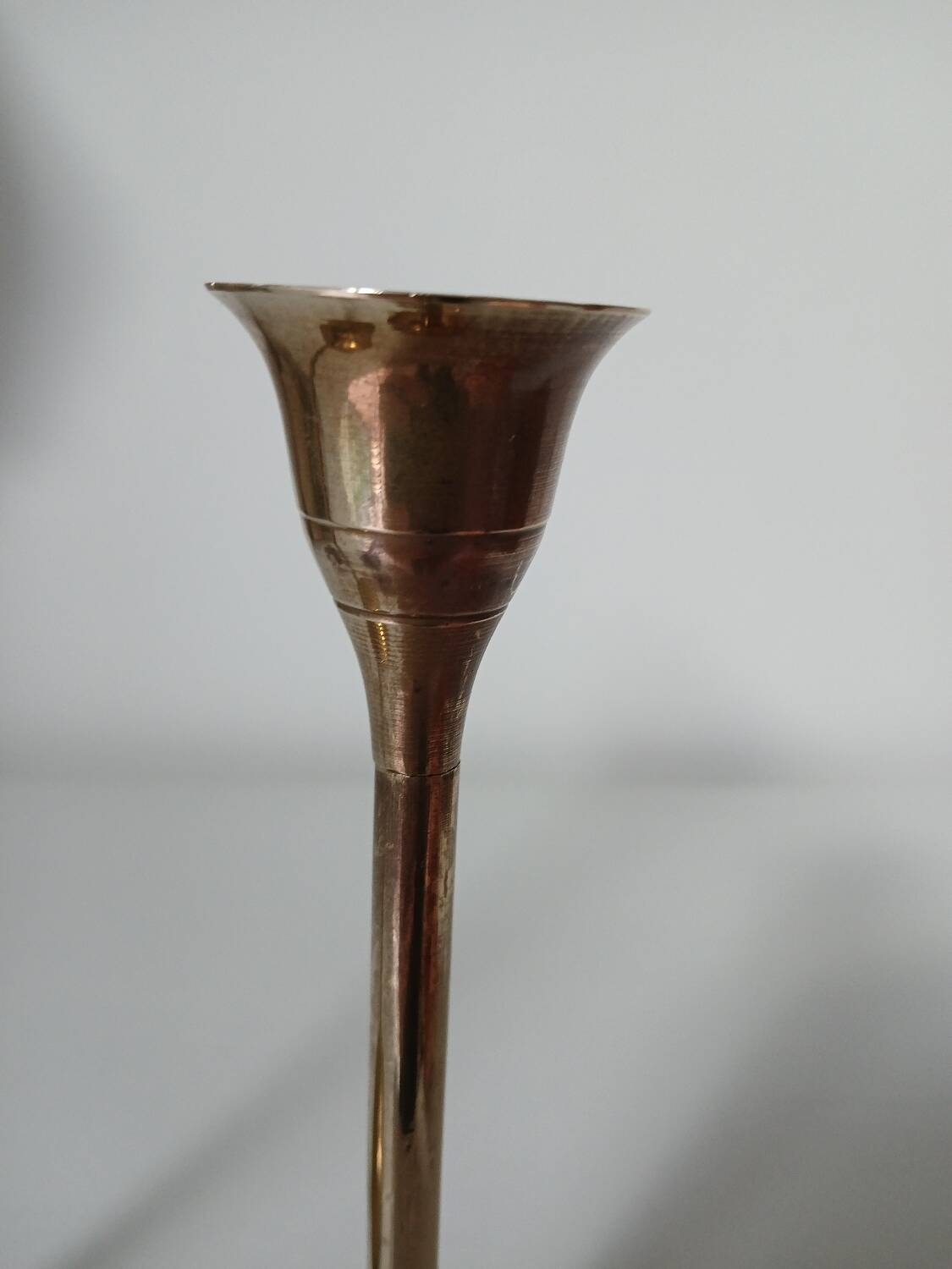 Set of two straight brass candlesticks.