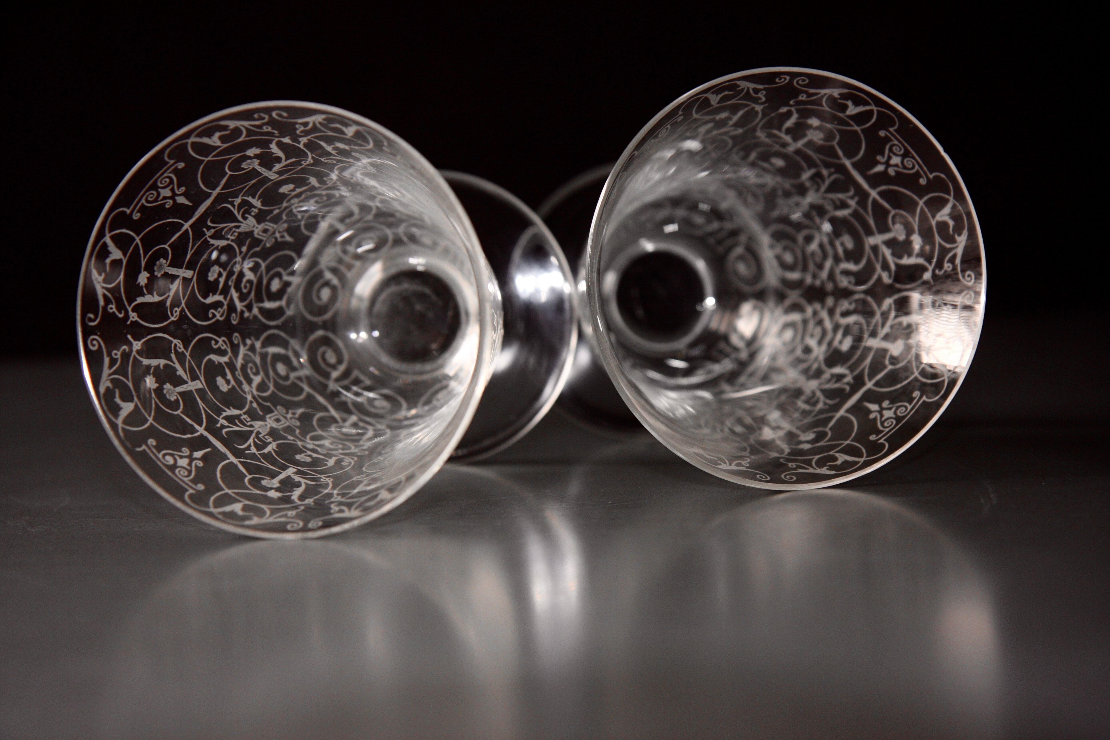 Two Baccarat glasses model "Michelangelo" in engraved crystal.