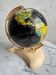 French mid-century school globe with black oceans on printed paper, cream plastic base
