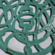 Enamelled cast iron trivet in blue with wrought iron decoration.
