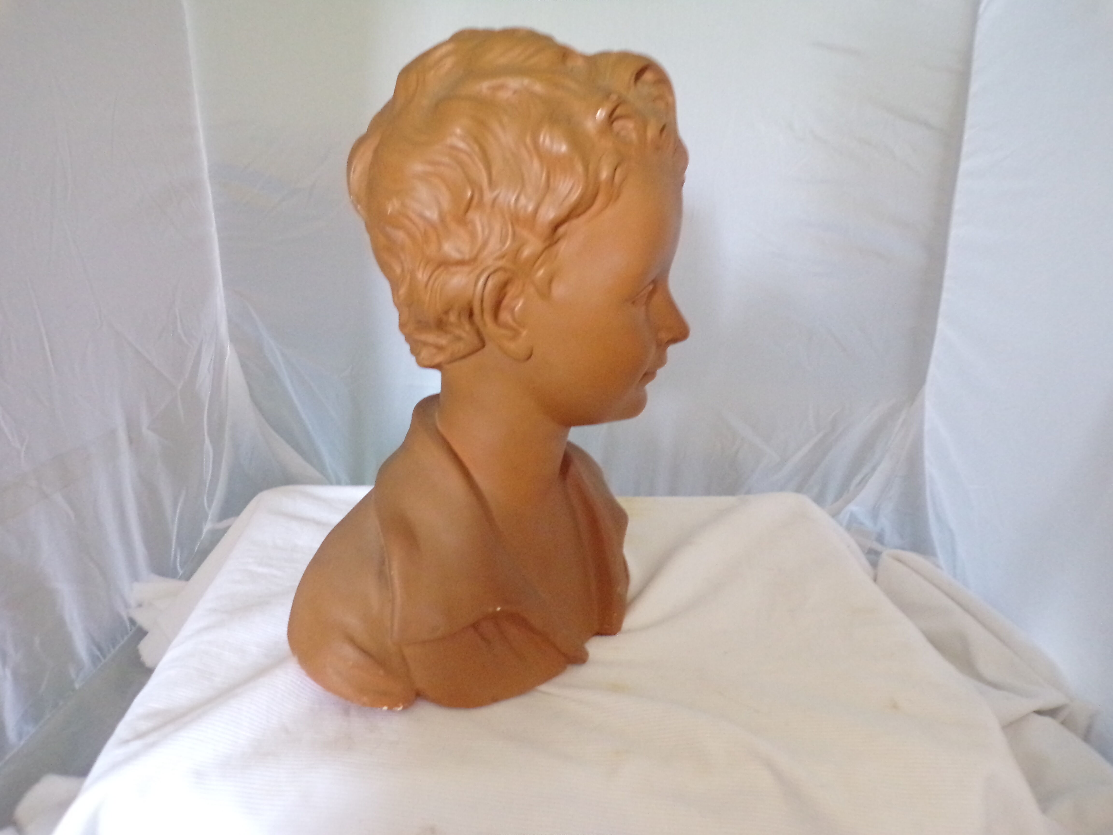 Bust of a young man in plaster