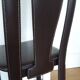 Set of 6 wooden chairs covered in leather.