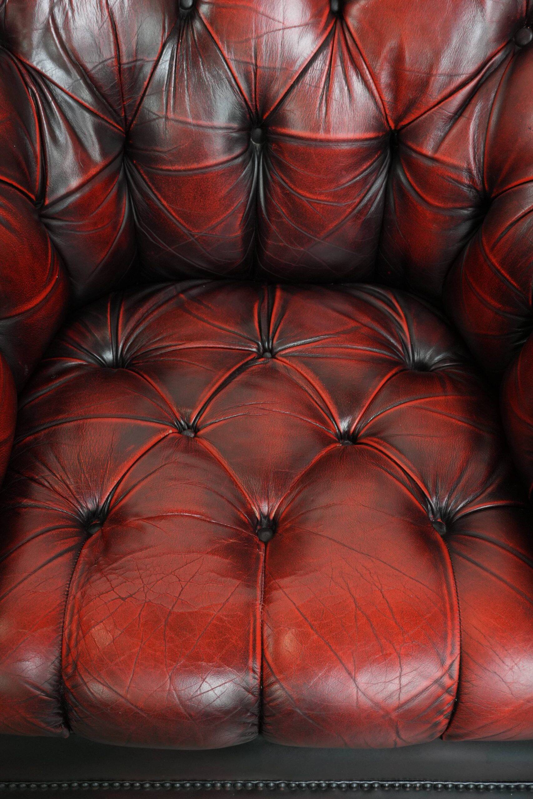 Classic cowhide Chesterfield button seat armchair in a beautiful red colour
