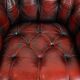 Classic cowhide Chesterfield button seat armchair in a beautiful red colour