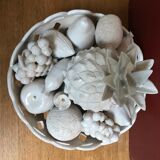 Trompe l'oeil fruit cut in white earthenware by Jean Roger, circa 1960.