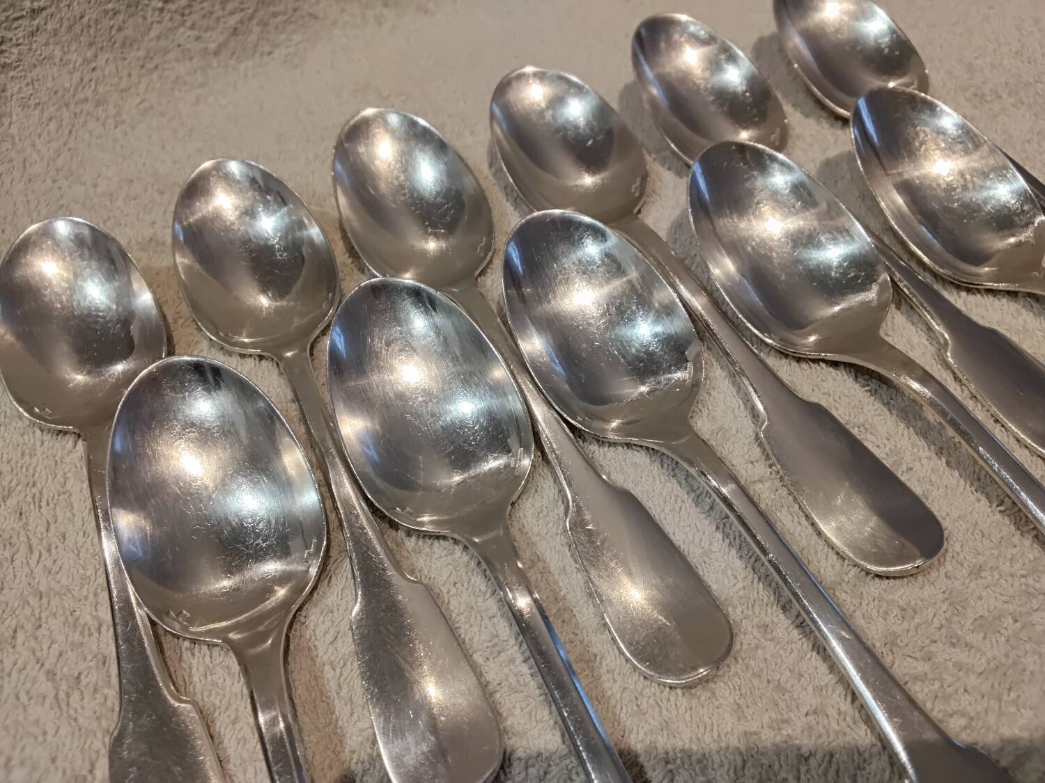 11 silver-plated dessert spoons by Christofle, Cluny pattern, striped