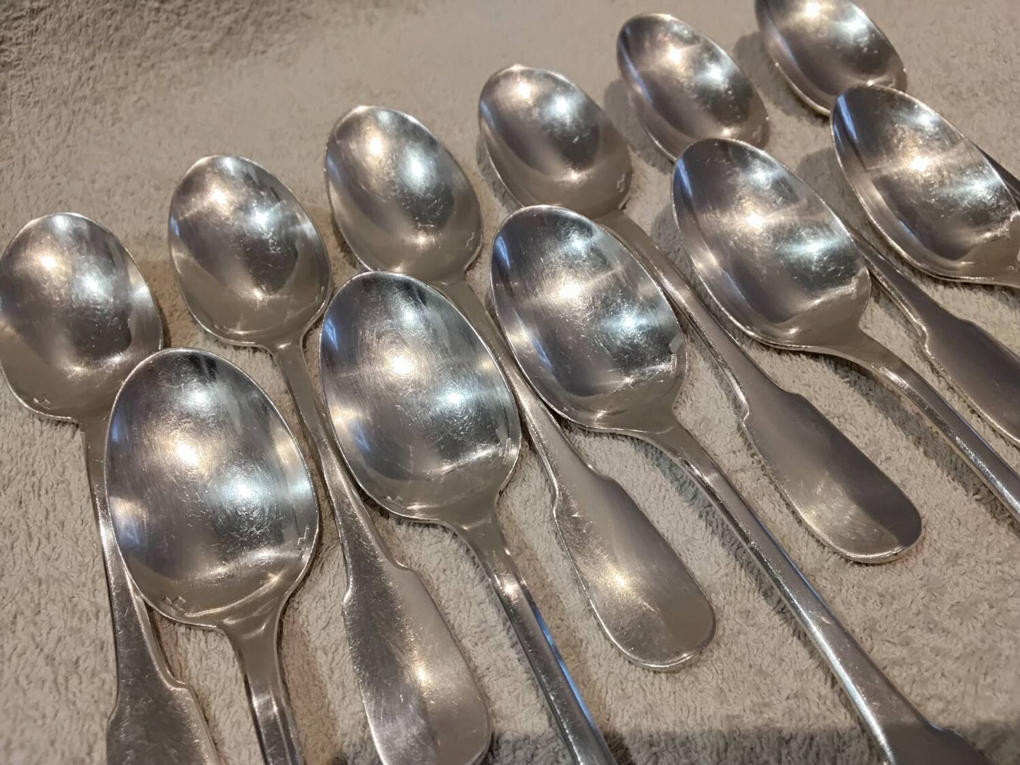 11 silver-plated dessert spoons by Christofle, Cluny pattern, striped