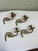 4 golden bronze piano arms