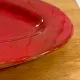 Plat en céramique rouge signé Voltz