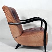 Sculptural Italian Mid-century leather and curved wood armchair from 50s