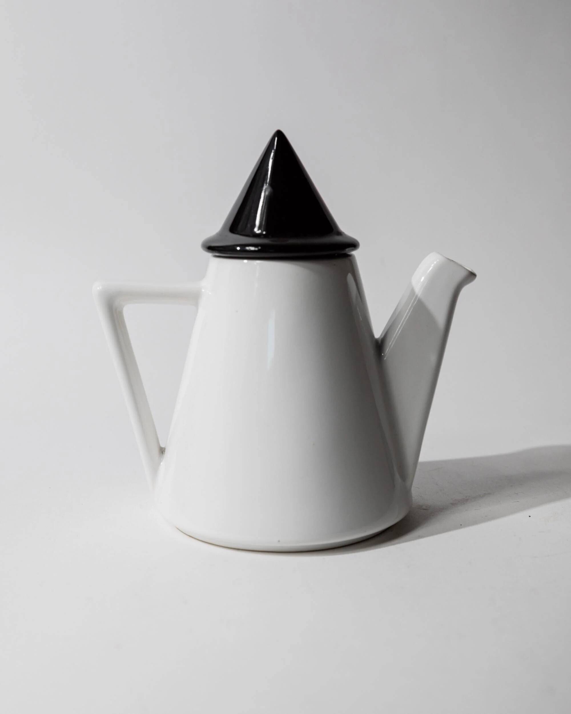 Vintage ceramic coffee pot or teapot from the 1980s, postmodern Memphis design, black and white triangles.