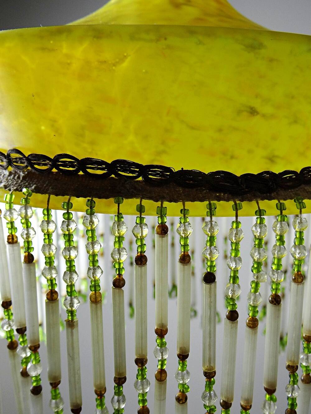 Antique Art Deco lampshade in yellow marbled glass with bead fringes.