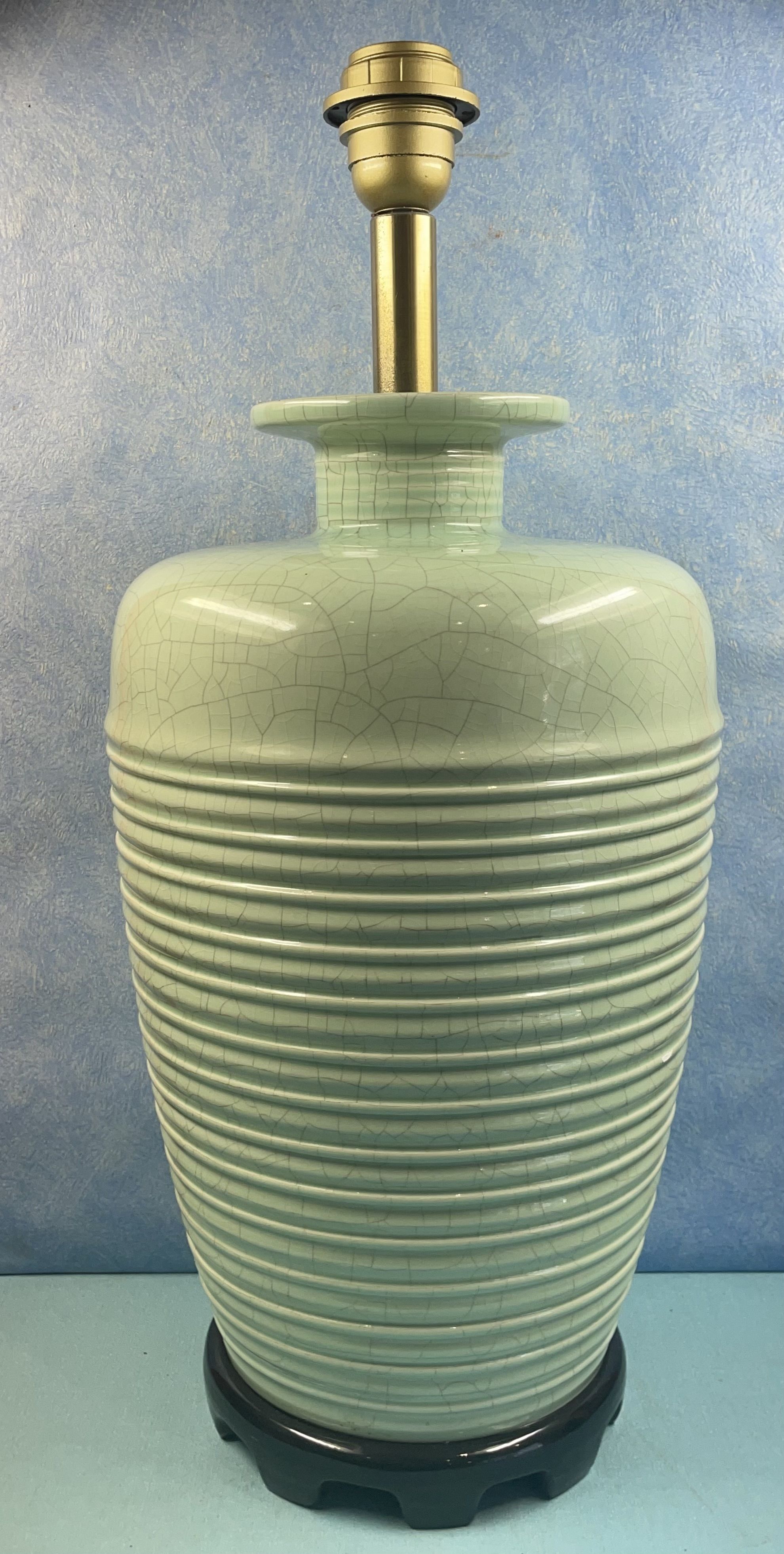 Contemporary ceramic lamp foot in green celadon color to electrify
