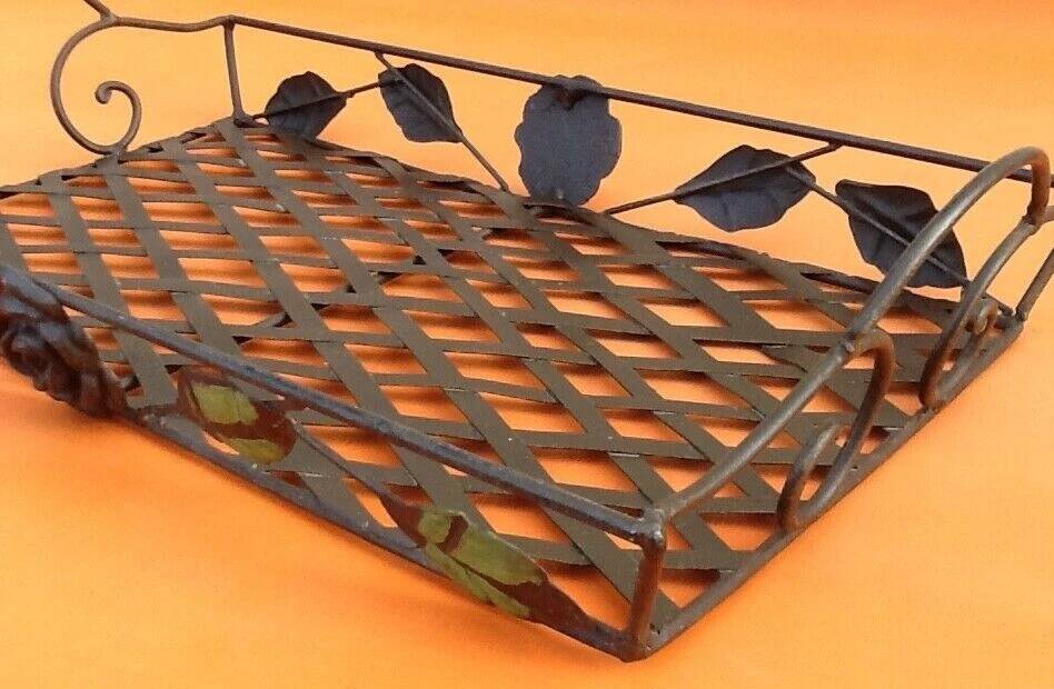 Rectangular metal serving tray with floral decoration.