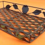 Rectangular metal serving tray with floral decoration.