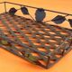 Rectangular metal serving tray with floral decoration.