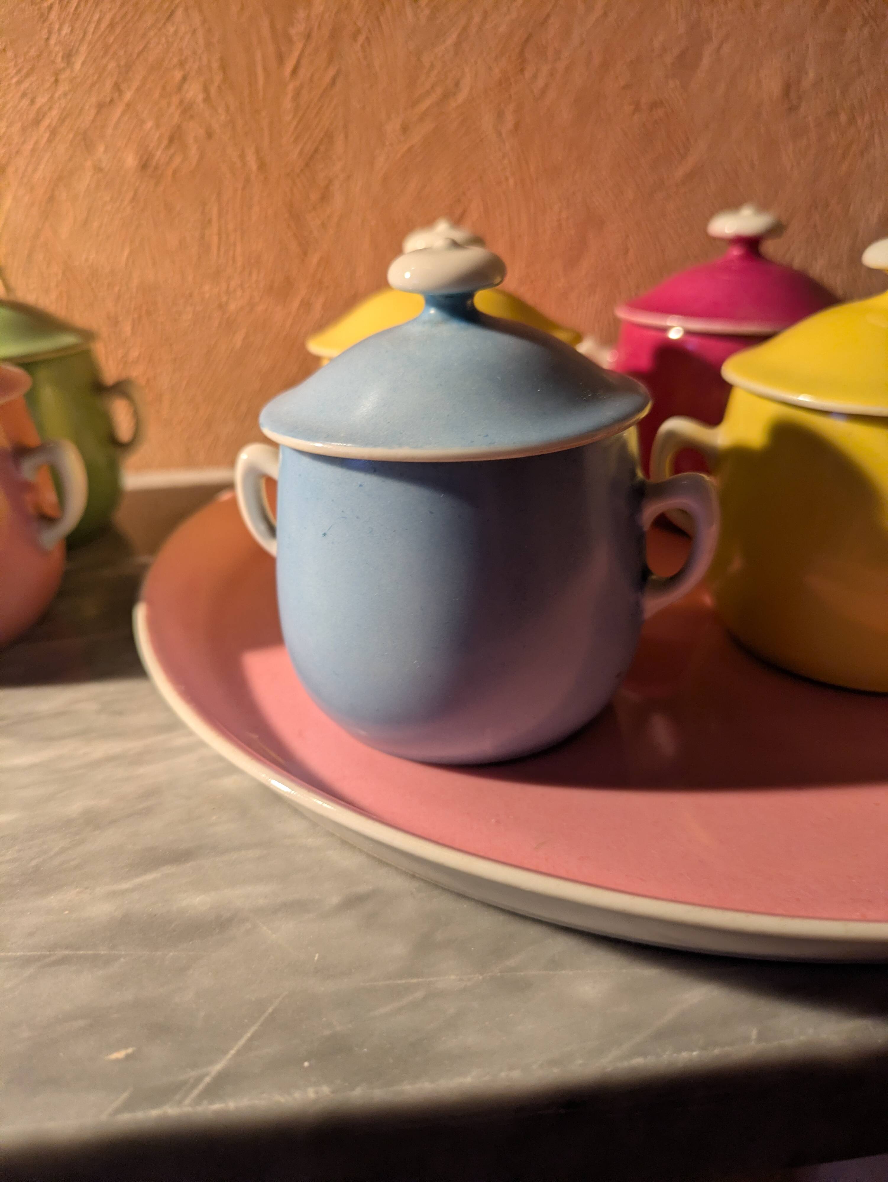 6 small porcelain cream pots from Limoges with a tray.