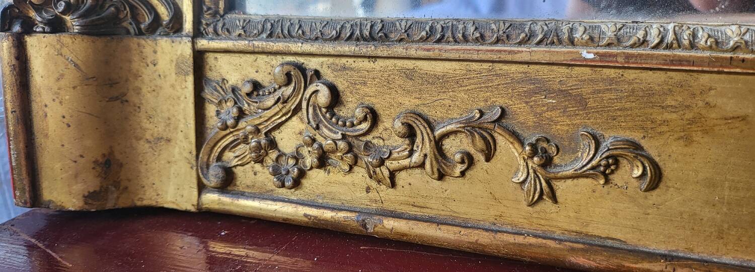 Antique Louis Philippe style gilded mirror decorated with floral motifs