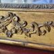 Antique Louis Philippe style gilded mirror decorated with floral motifs