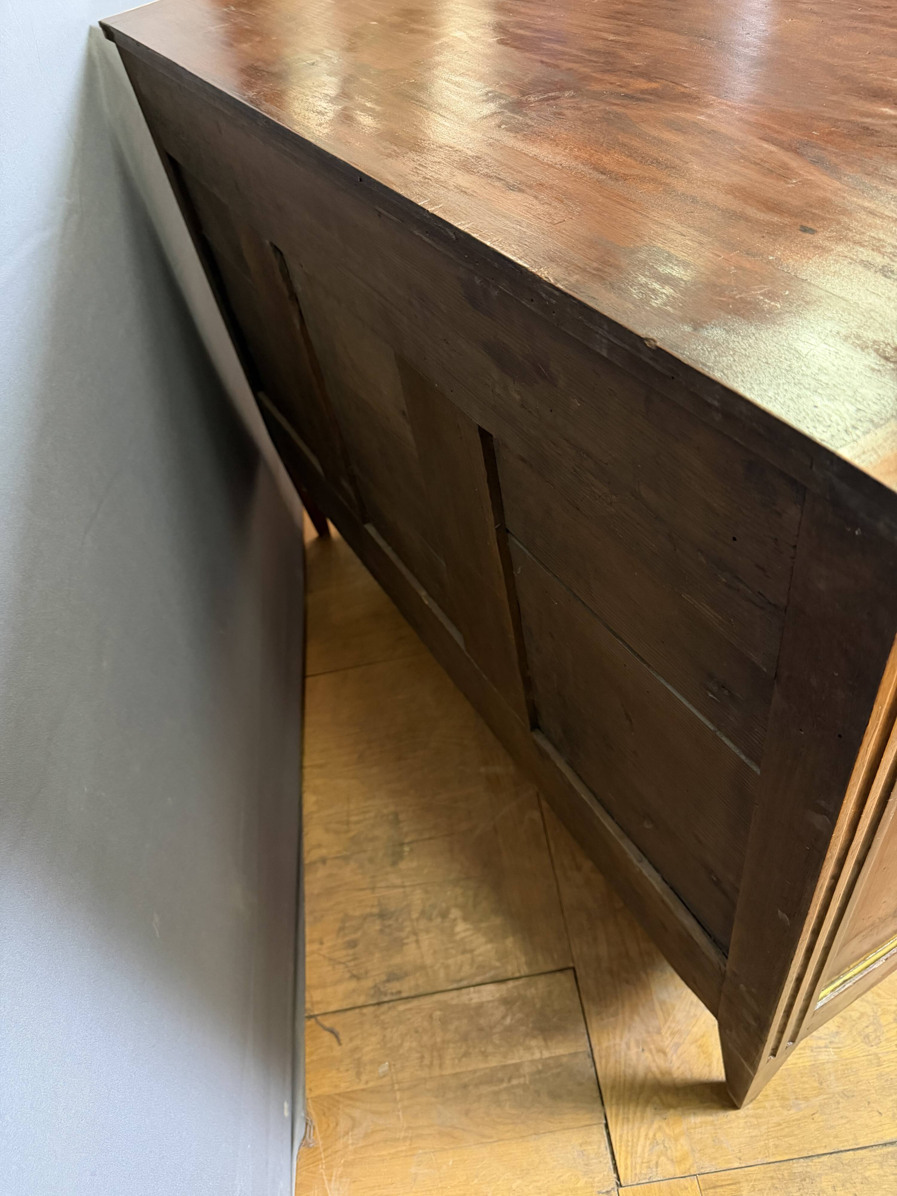 Louis XVI commode in walnut, beech, and brass.