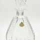 Matching pair of bohemian crystal decanters with art deco motifs