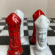 Chess set with ceramic board and pieces.