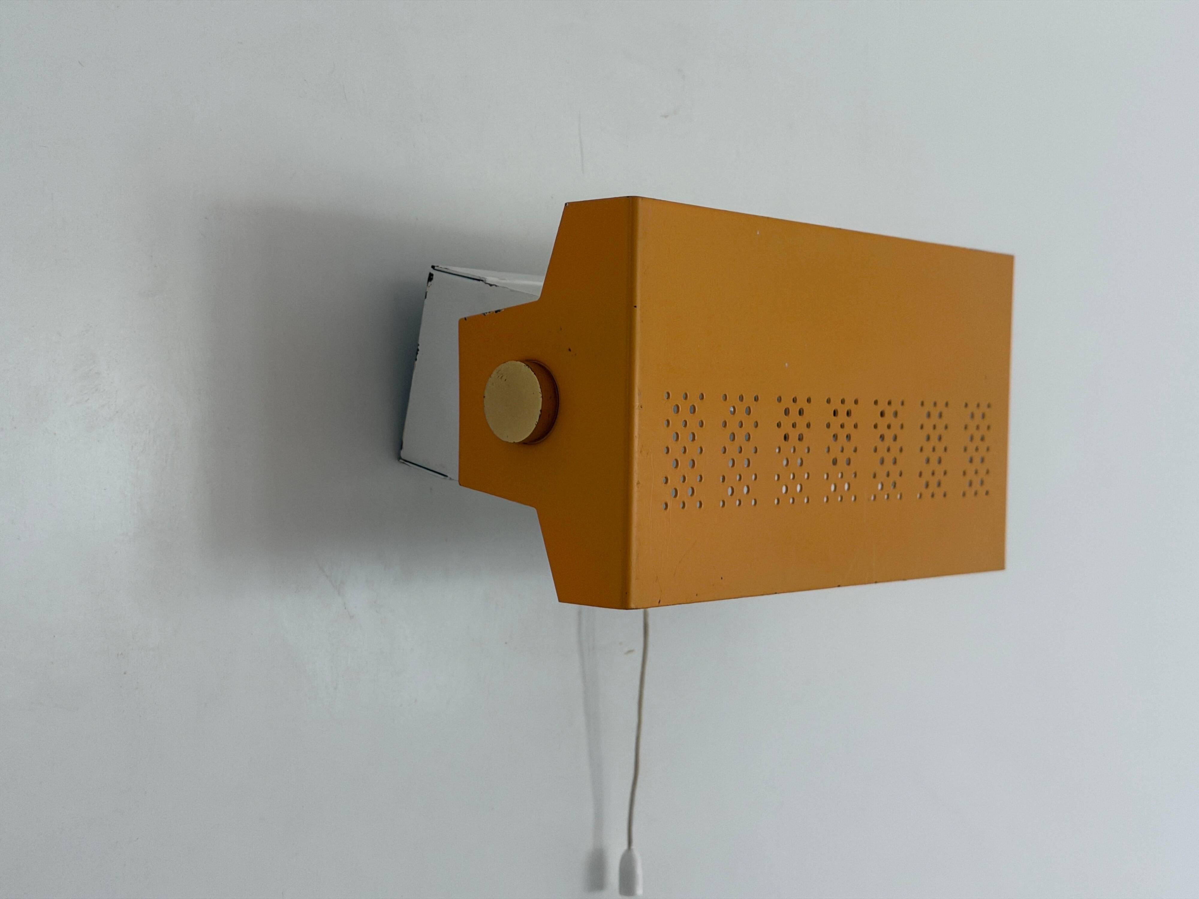 Pair of yellow metal wall lights from the mid-century by N Leuchten, 1960s, Germany.