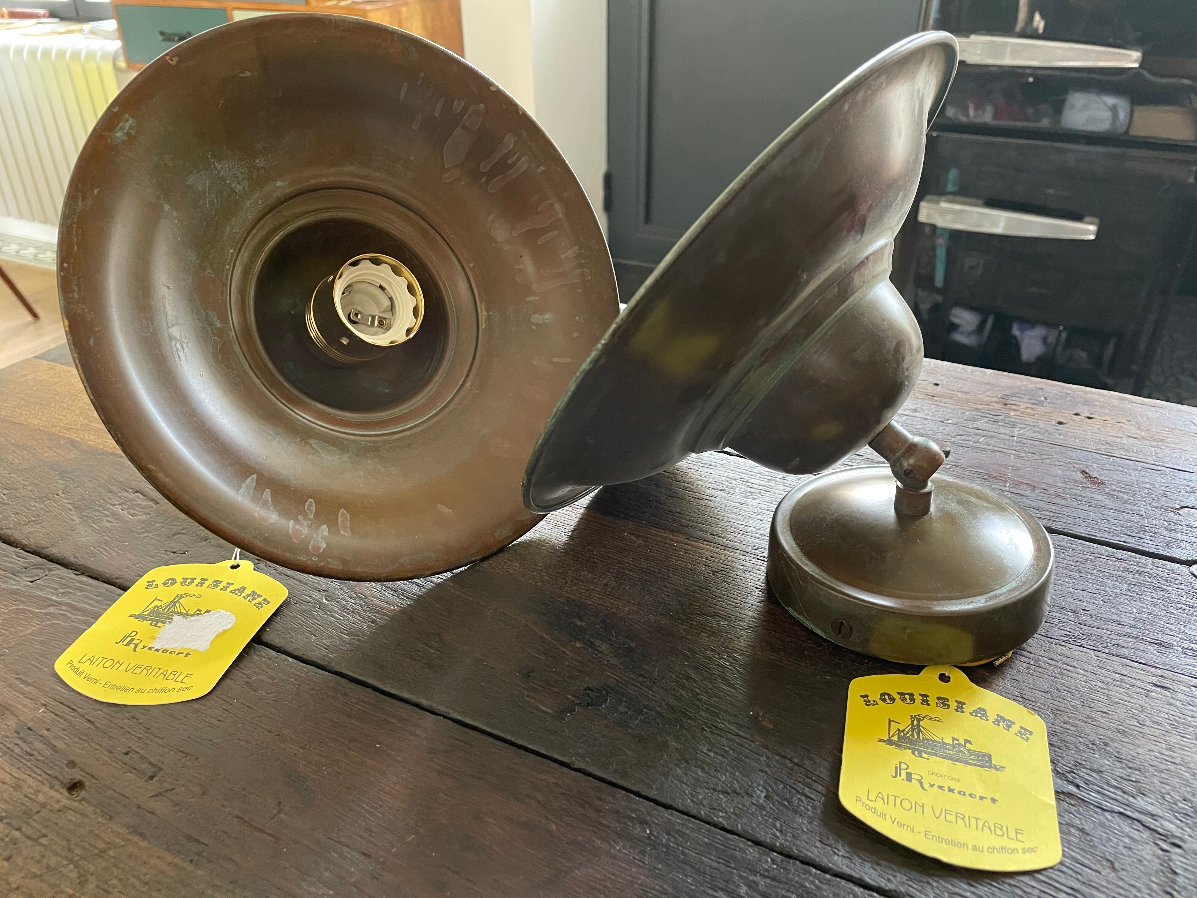 Pair of industrial brass wall lamps