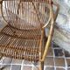 Rattan armchair and his feet rest