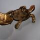 Golden brass turtle in decorative ashtray