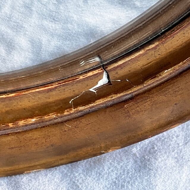 Witch's mirror with wood frame and curved ice