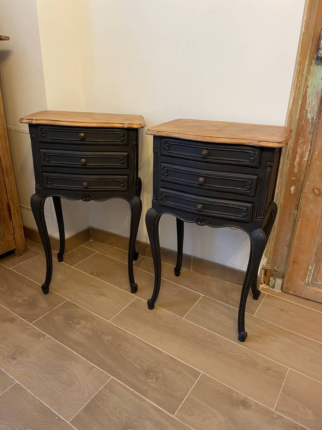 Pair of Louis XV style bedside tables with matt black patina