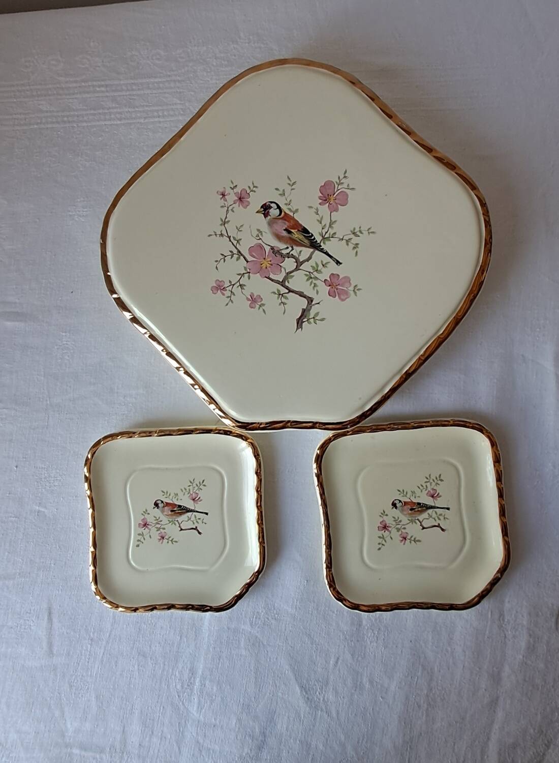 Trivet and bottle holder Salin, 1950s. Bird on branch.