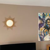 Mirror sun in braided rattan.