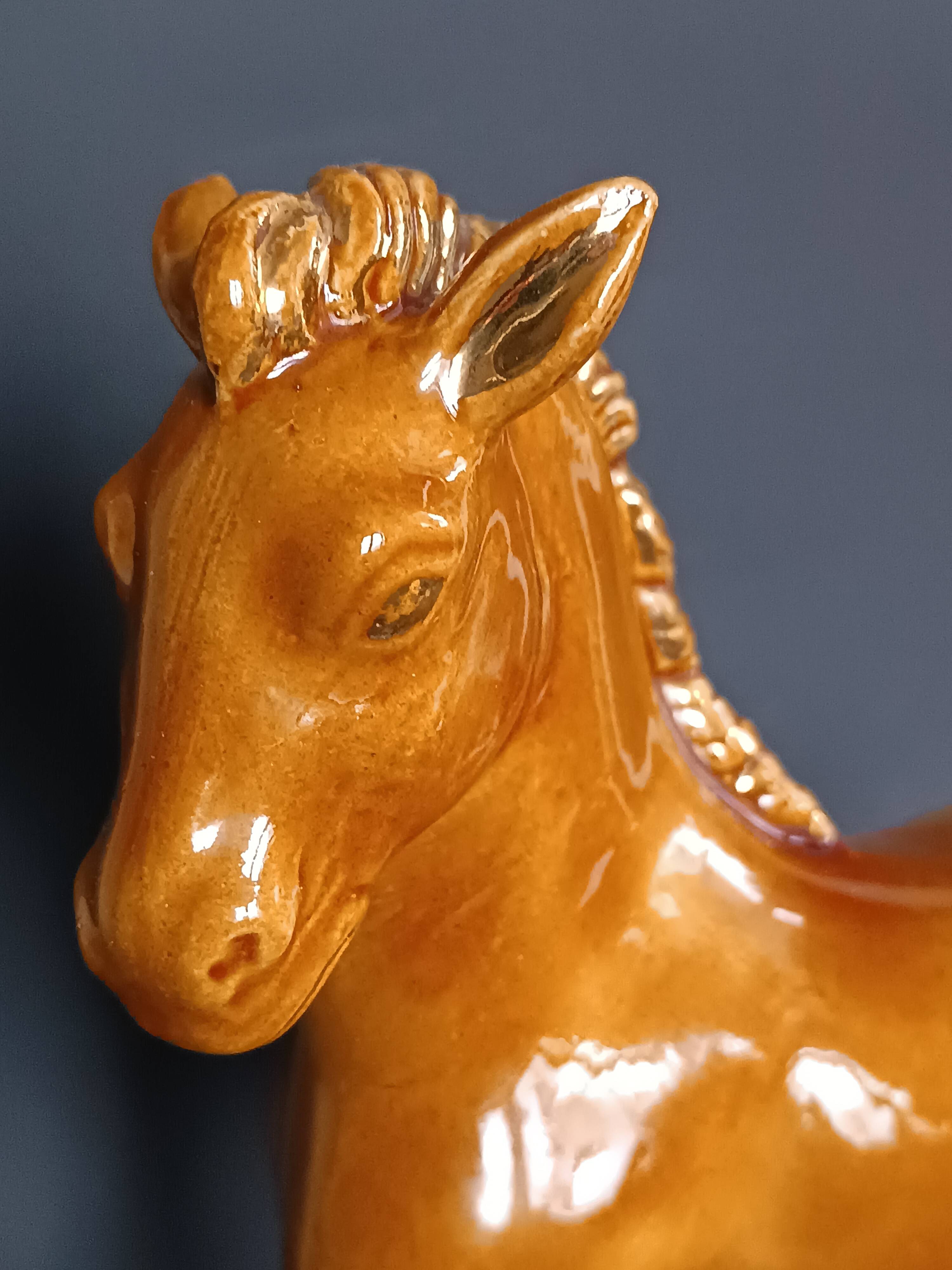 Ceramic horse sculpture with wild glaze and gold, signed Art Deco.