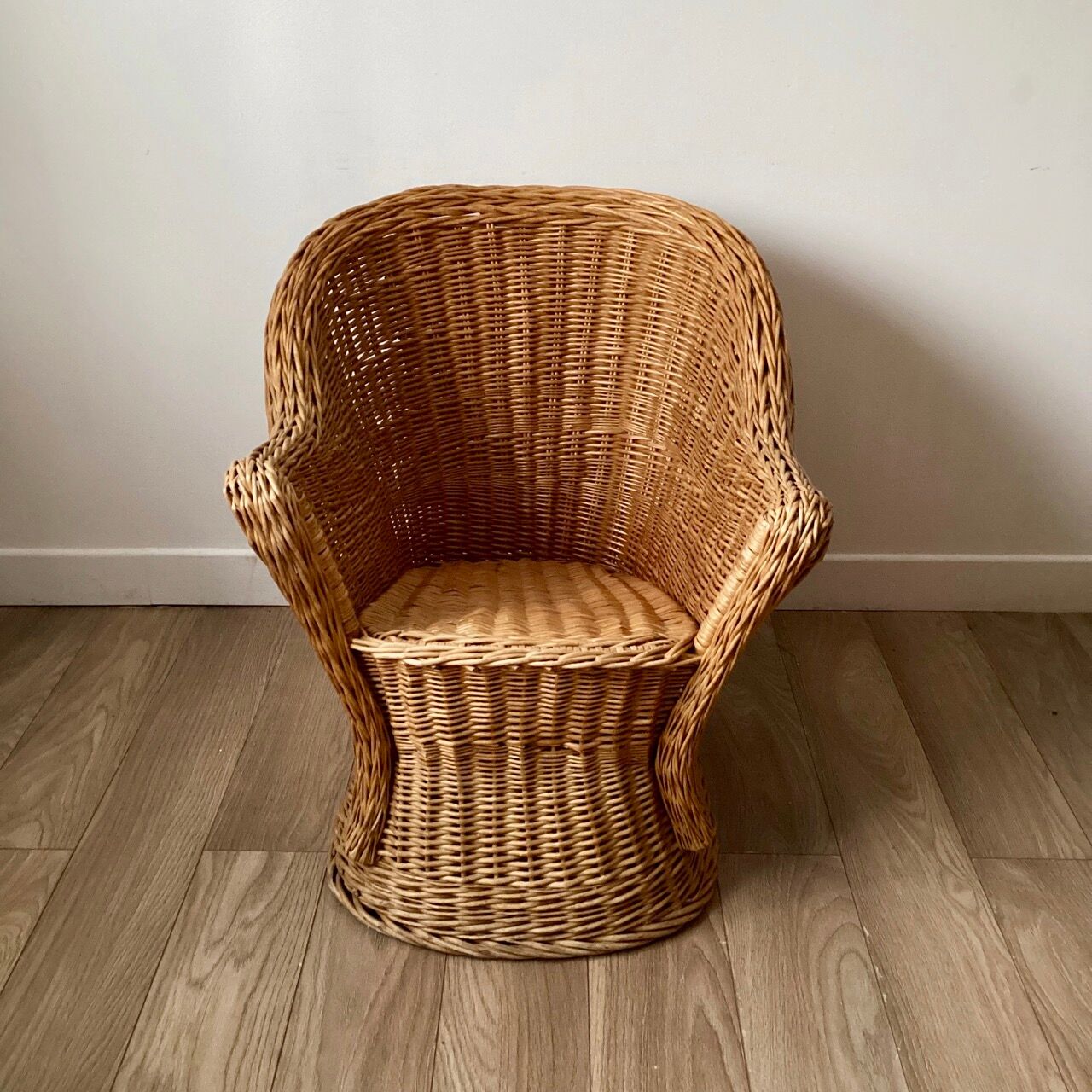 Braided wicker armchair