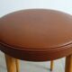 Baumann low stool from the 60s in brown leatherette