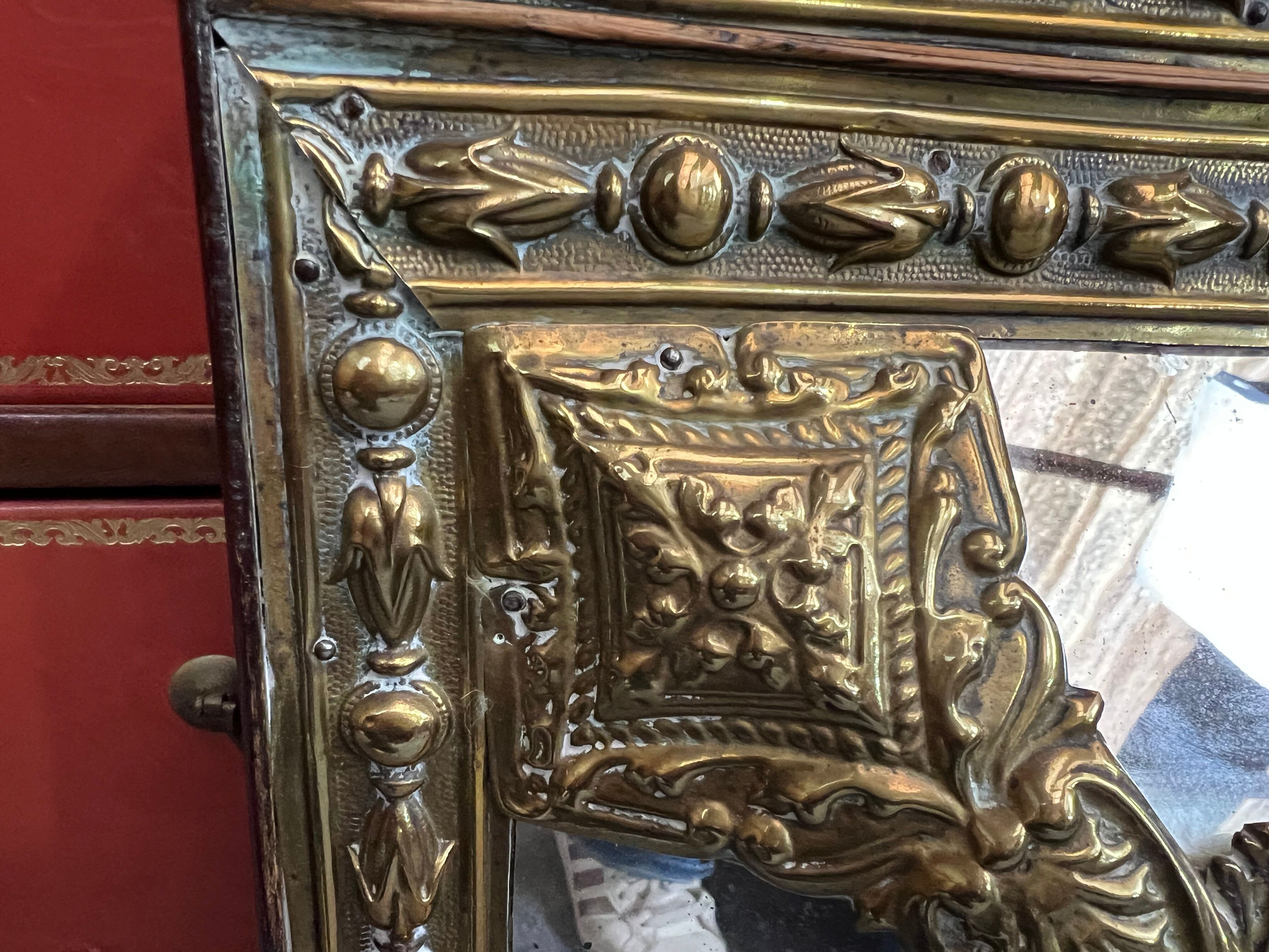 Old repoussé brass pareclose mirror