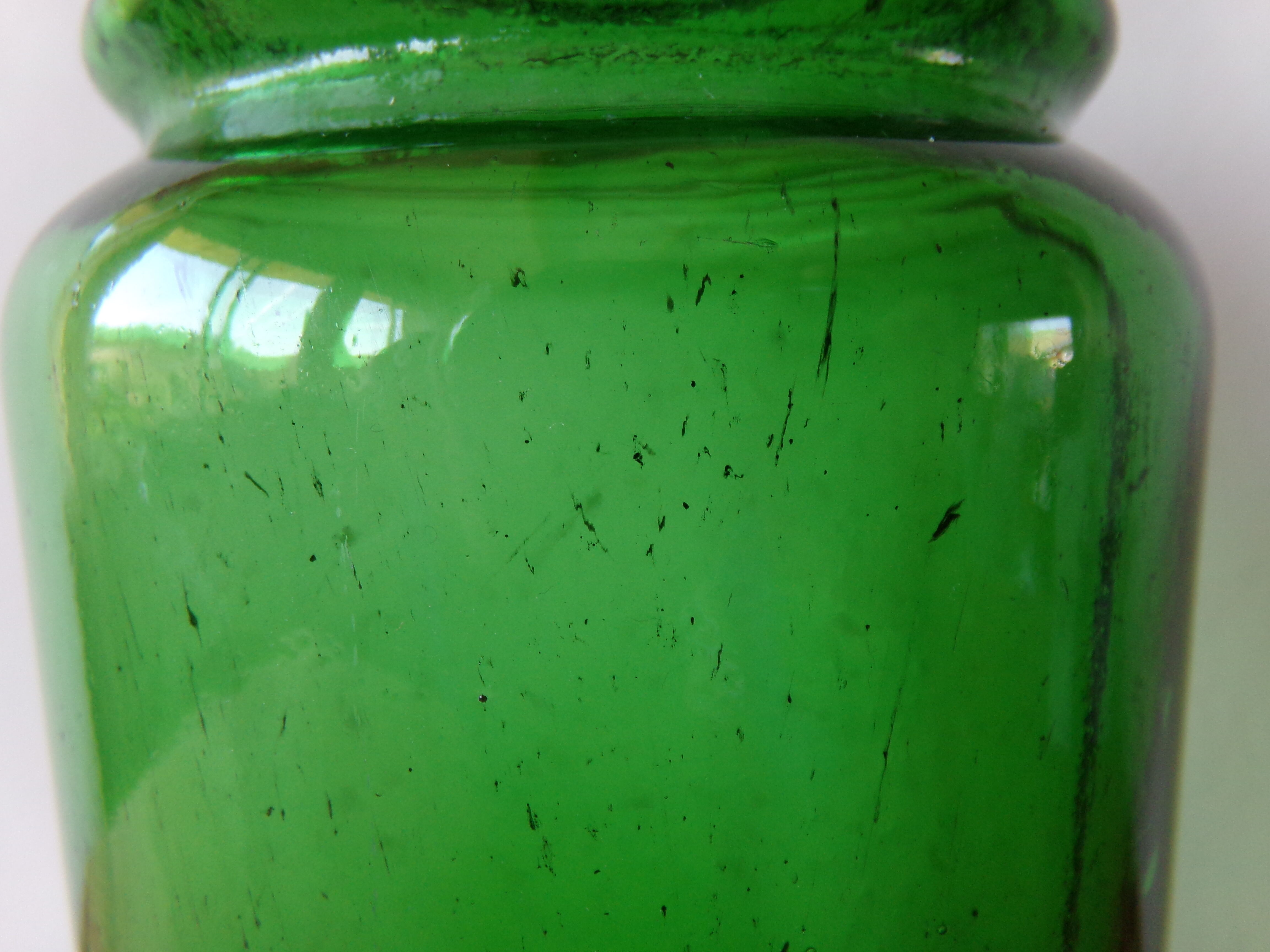 Antique green glass jar