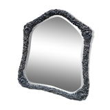 Old mirror carved in gray metal