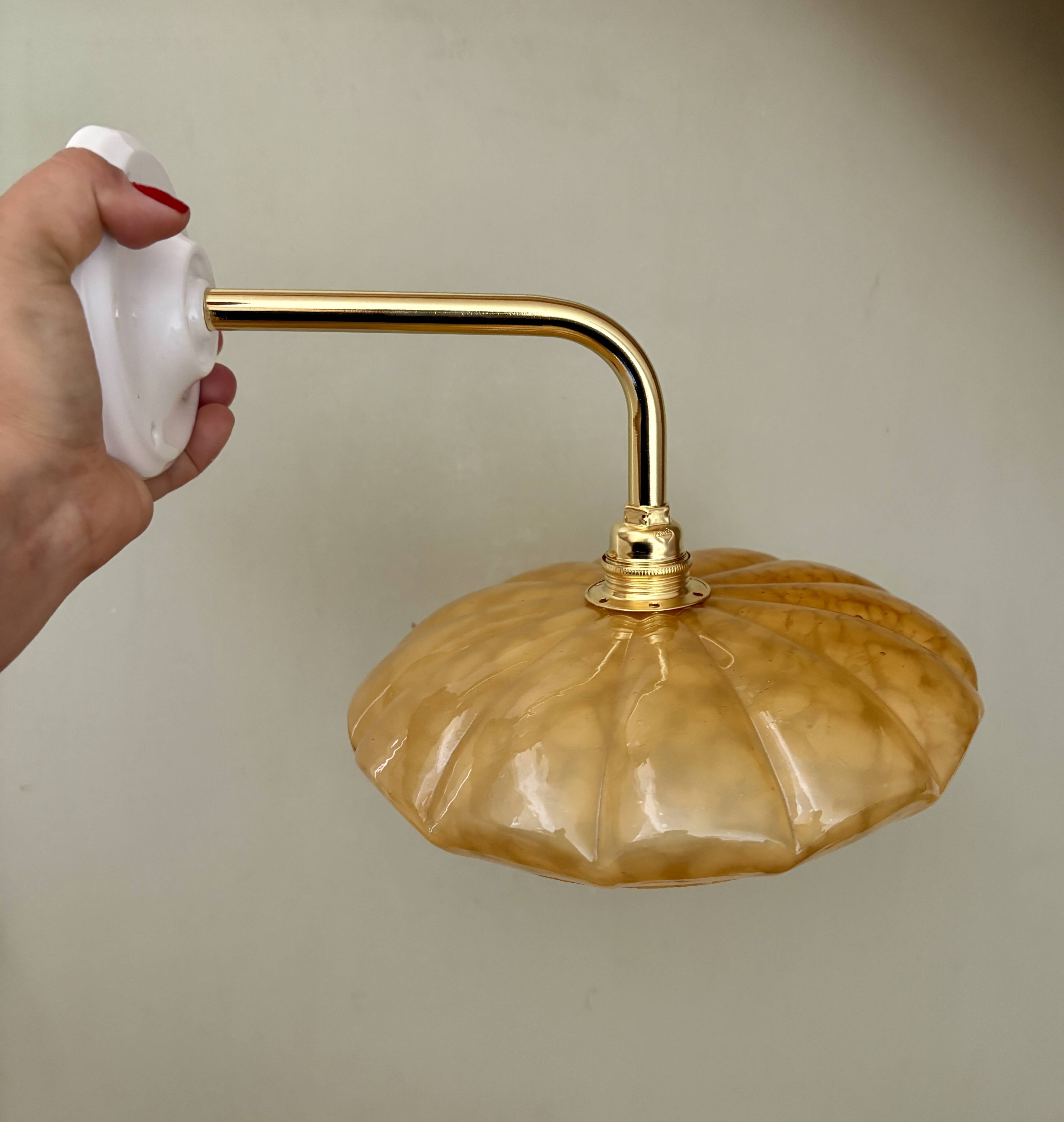 Antique wall lamp with yellow Clichy glass shade