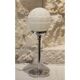 Chrome metal lamp with glass globe, Art Deco style, 20th century period.