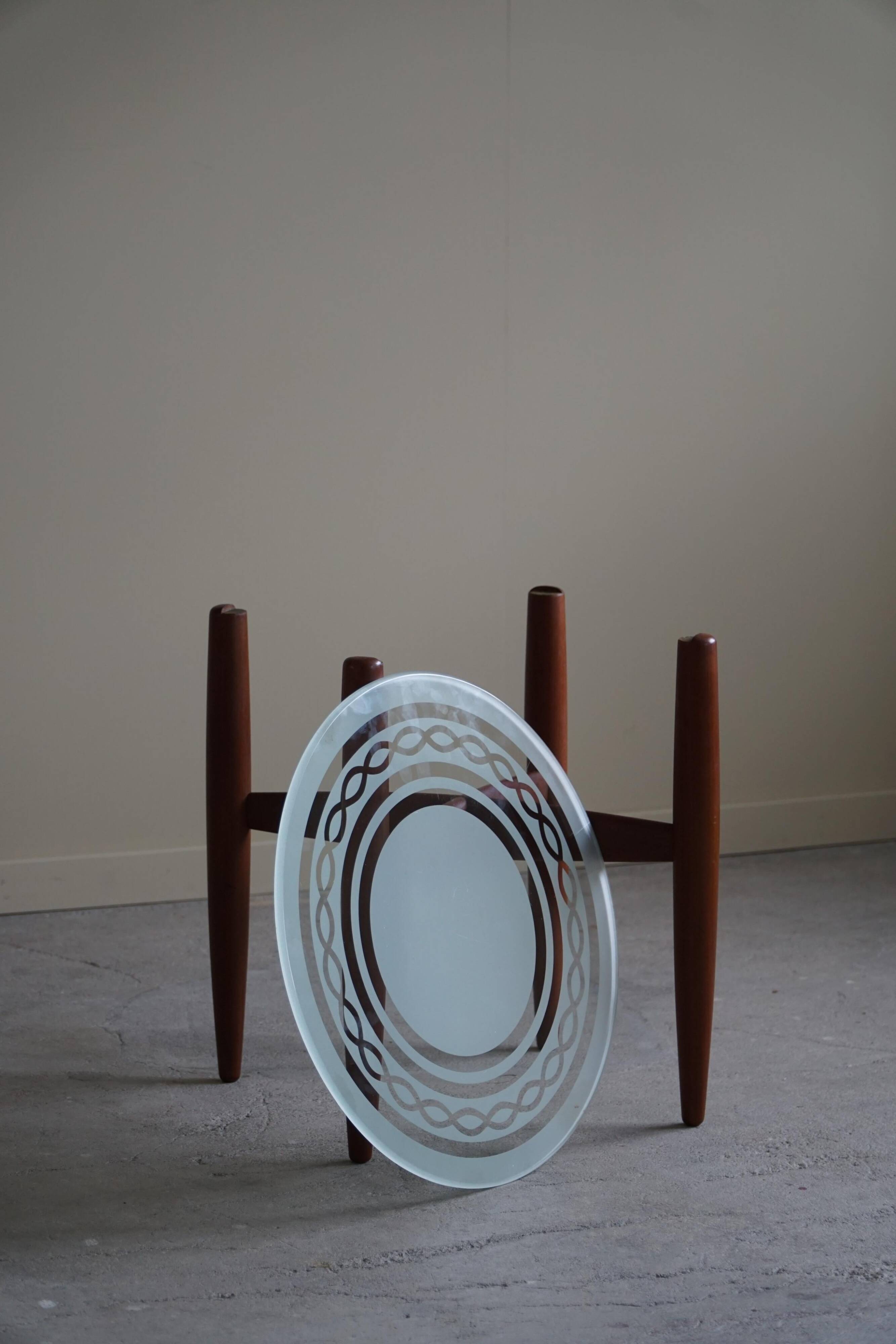 Teak and glass side table, mid-century Danish design, made in the 1960s.
