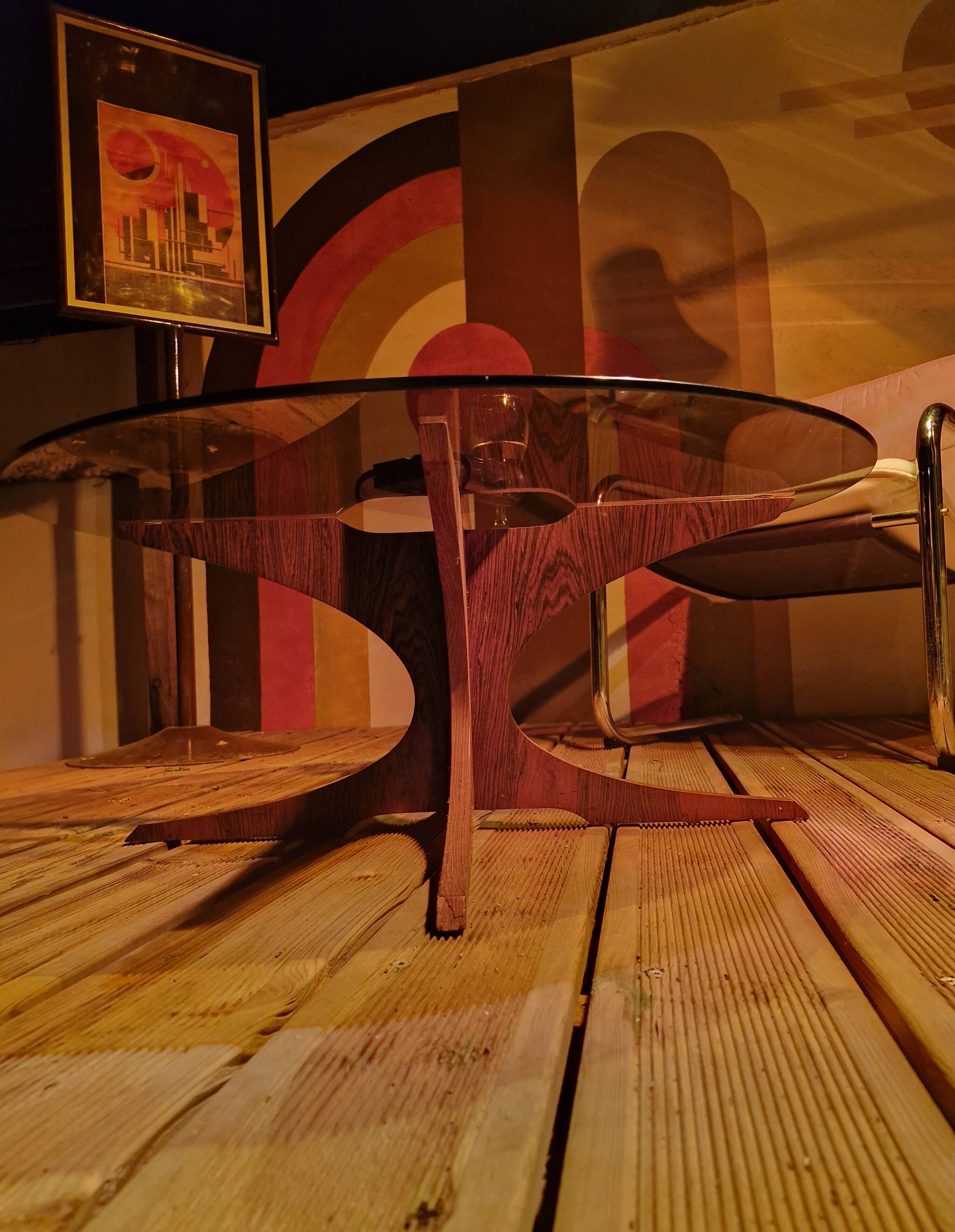 Vintage coffee table from the 60s and 70s by Hugues POIGNANT, smoked glass & teak.