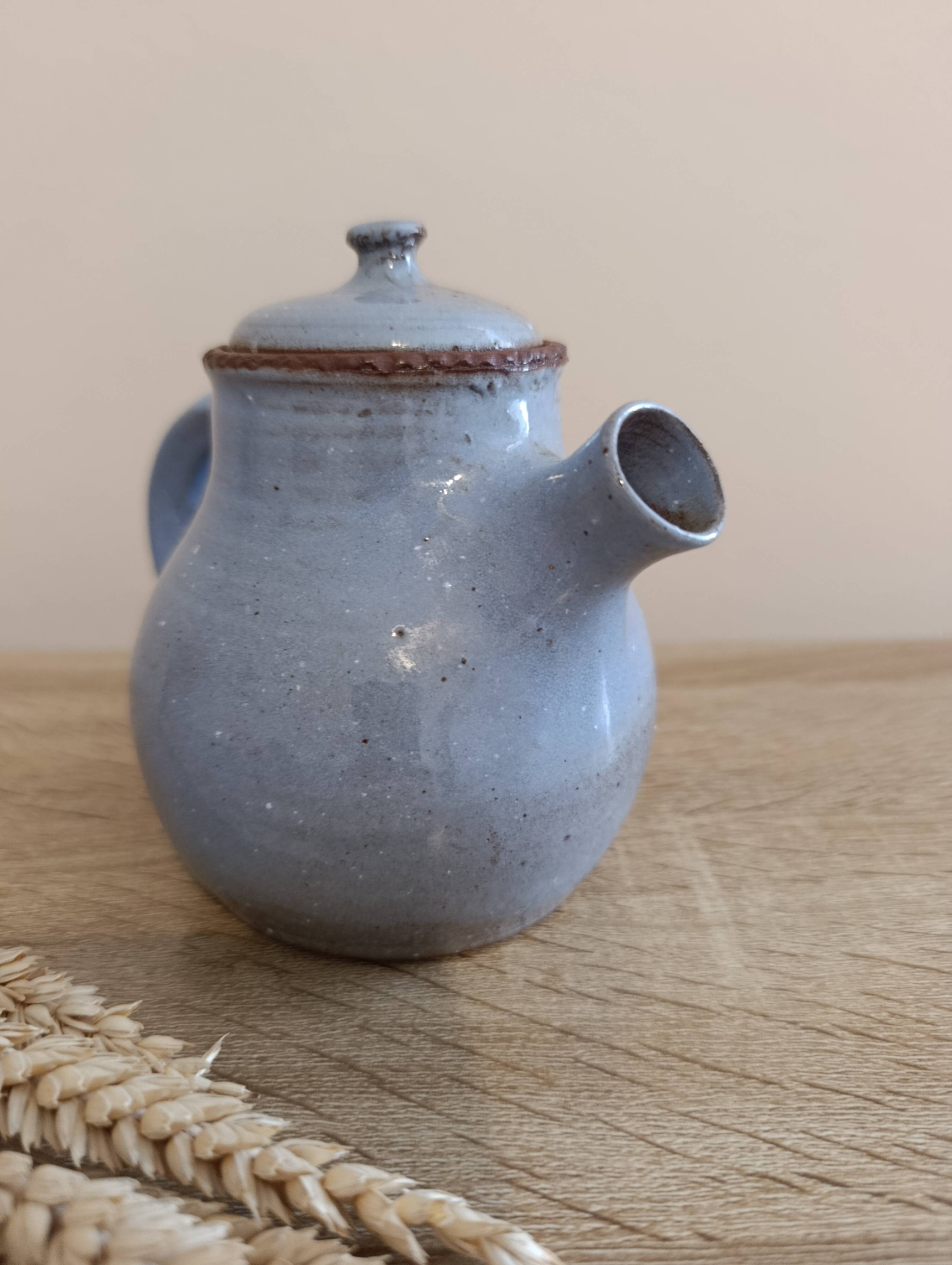Ceramic teapot in blue/grey glaze, signed by Jeanne and Norbert Pierlot.